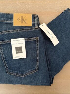 Calvin Klein Dark Blue Slim Straight Jeans with Leather Patch